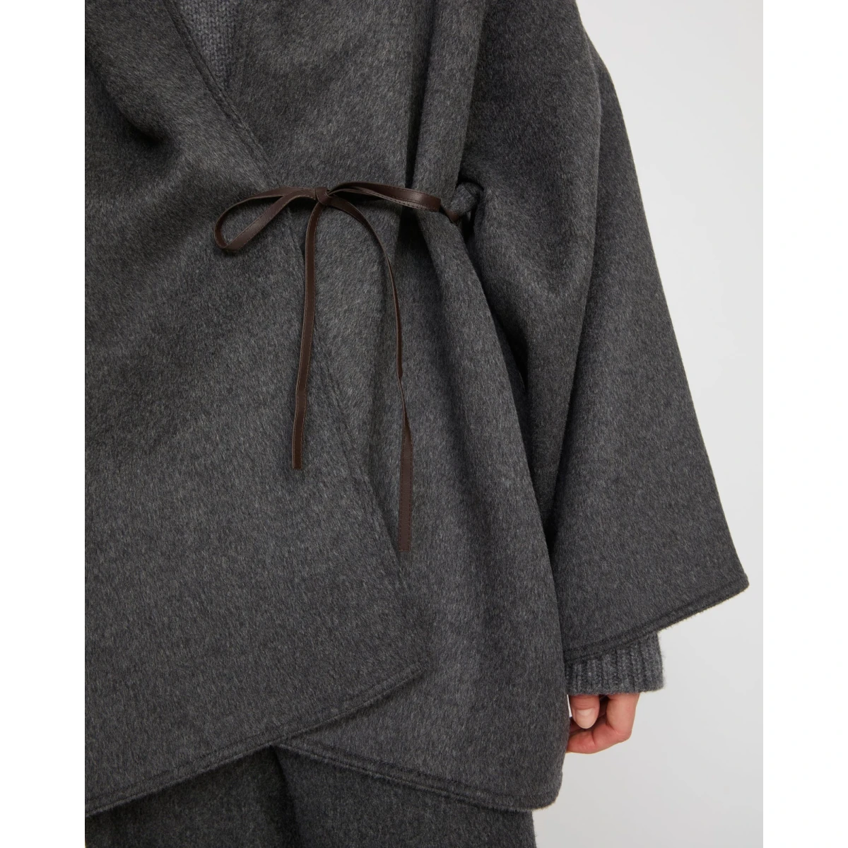 Woman wearing Yves Salomon shearling fur coat – luxury outerwear at Coveti