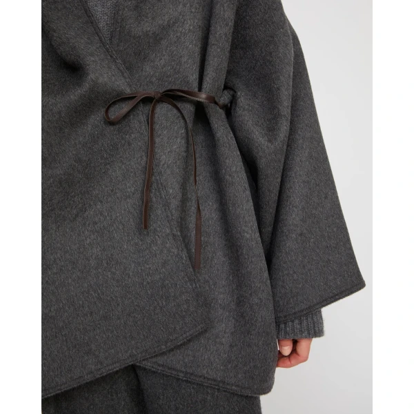 Woman wearing Yves Salomon shearling fur coat – luxury outerwear at Coveti
