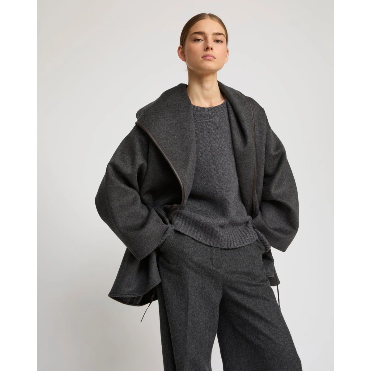 Woman wearing Yves Salomon shearling fur coat – luxury outerwear at Coveti