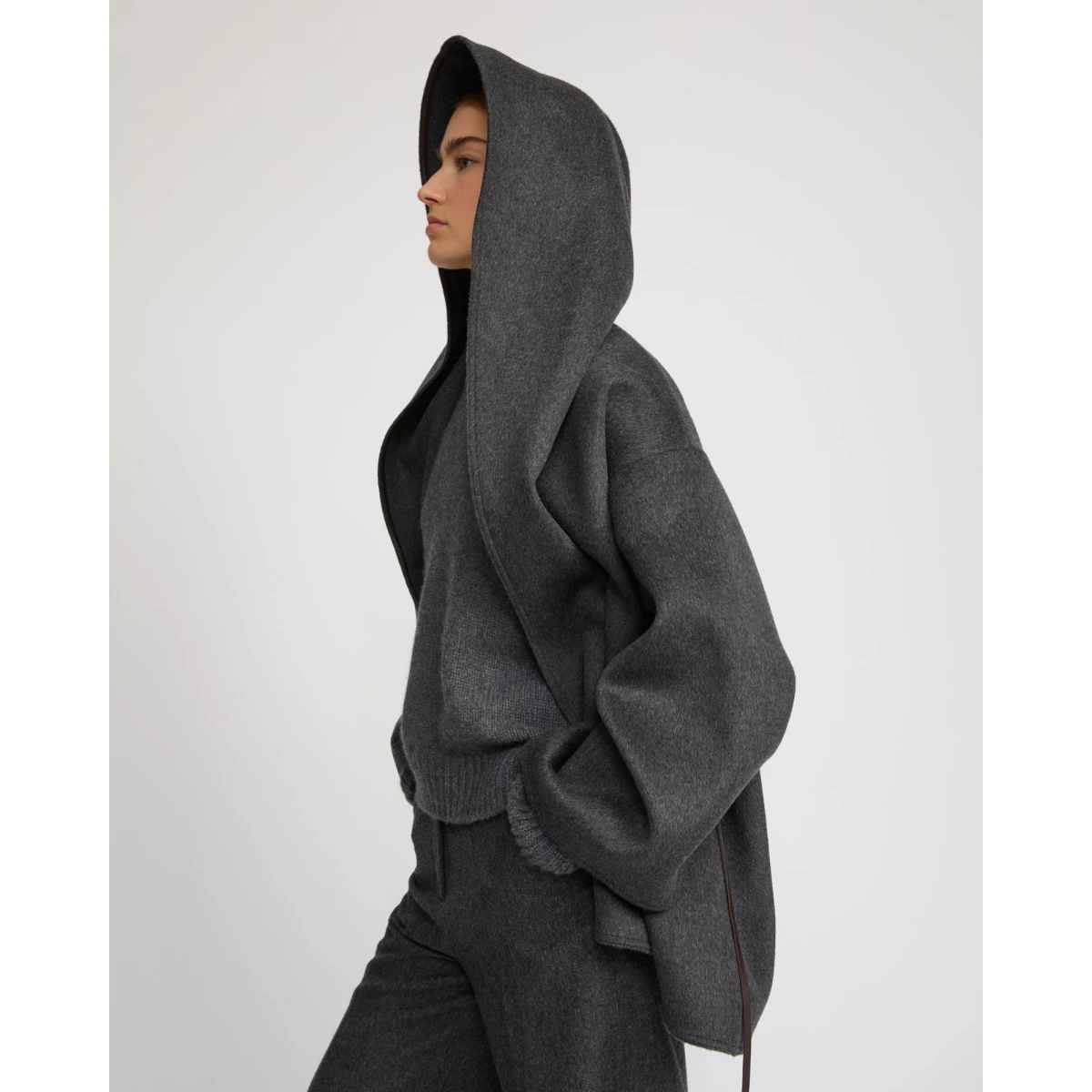 Woman wearing Yves Salomon shearling fur coat – luxury outerwear at Coveti