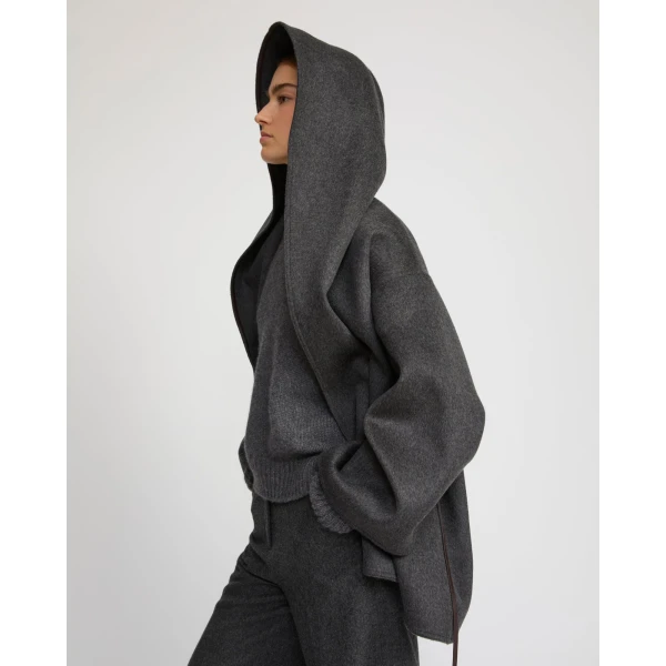Woman wearing Yves Salomon shearling fur coat – luxury outerwear at Coveti