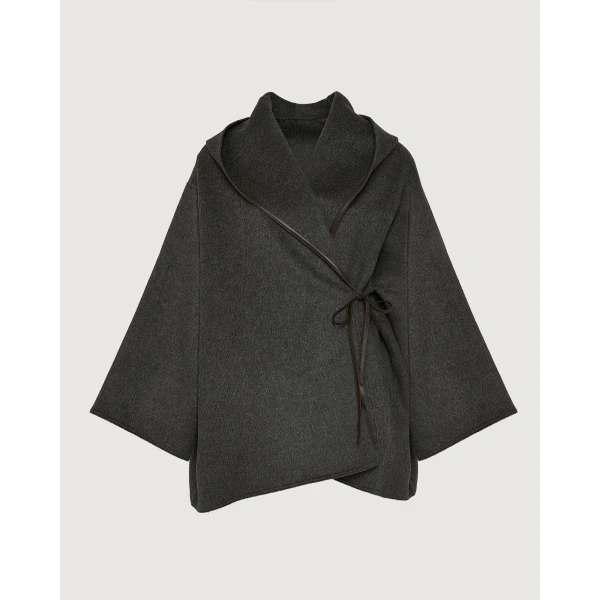 Woman wearing Yves Salomon shearling fur coat – luxury outerwear at Coveti