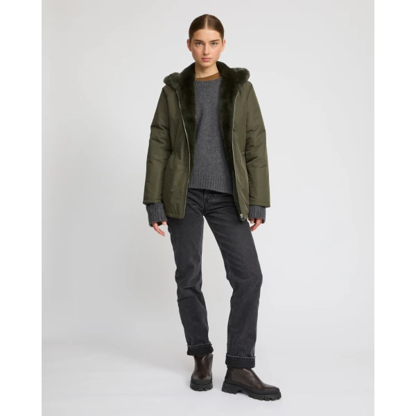 Woman wearing Yves Salomon shearling fur coat – luxury outerwear at Coveti