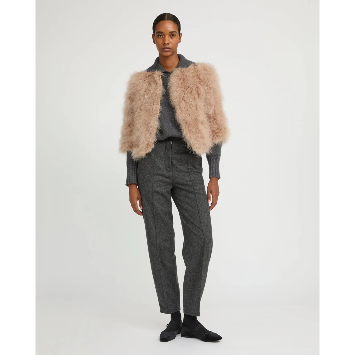 Woman wearing Yves Salomon shearling fur coat – luxury outerwear at Coveti