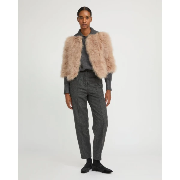 Woman wearing Yves Salomon shearling fur coat – luxury outerwear at Coveti
