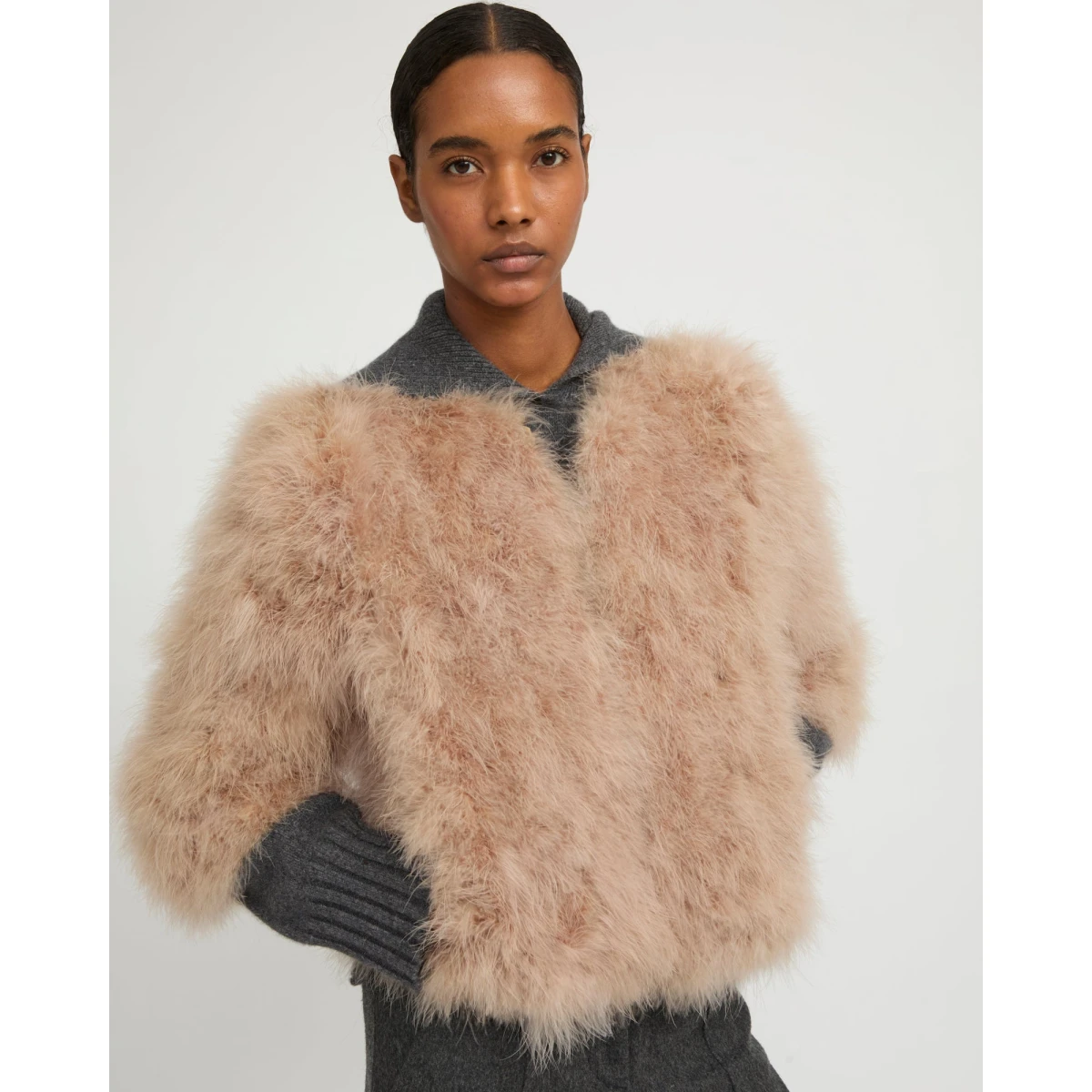 Woman wearing Yves Salomon shearling fur coat – luxury outerwear at Coveti