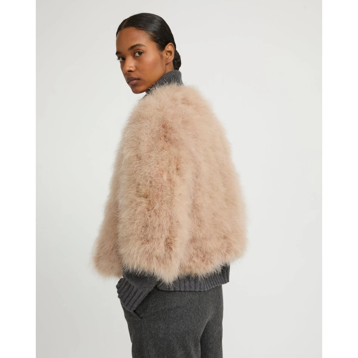 Woman wearing Yves Salomon shearling fur coat – luxury outerwear at Coveti