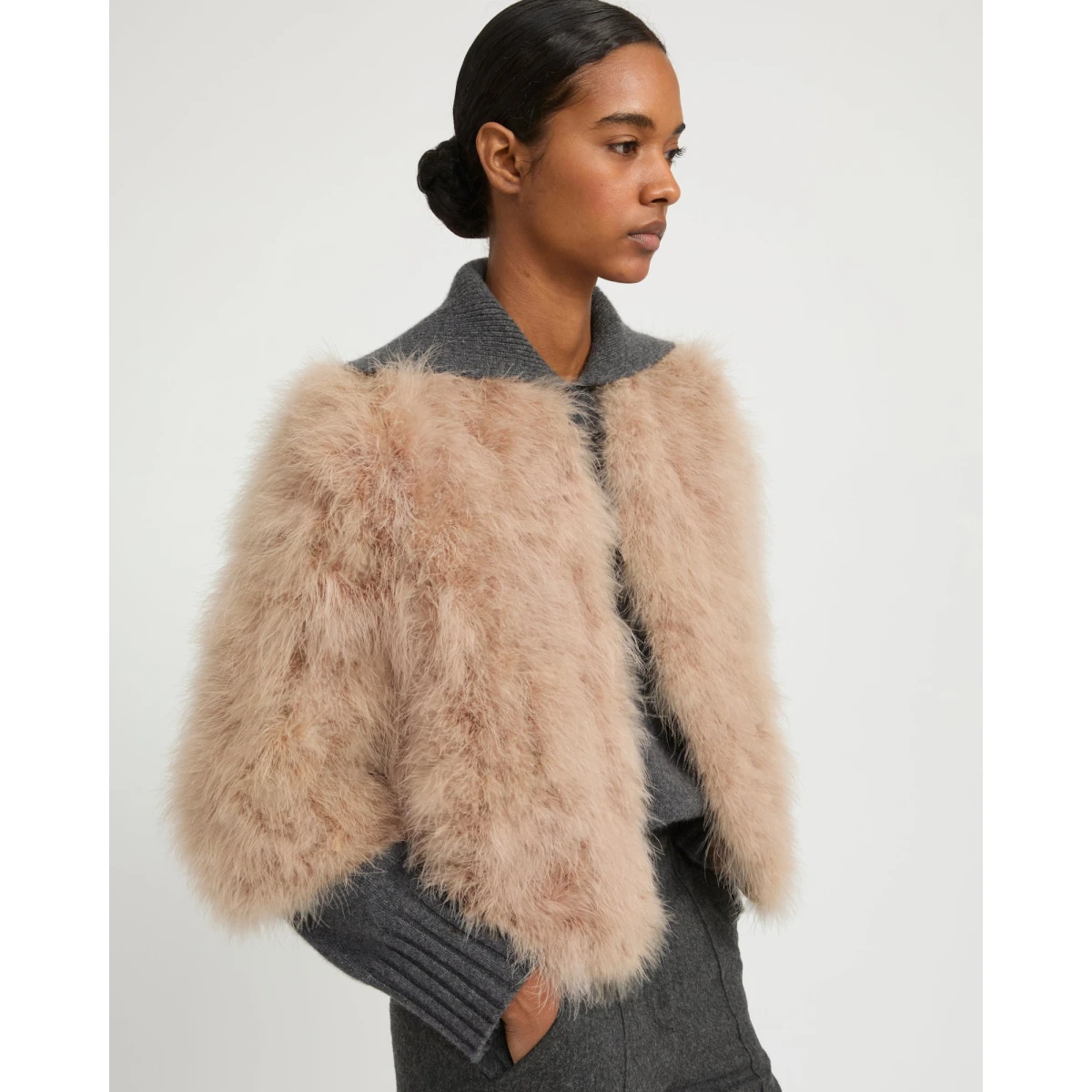 Woman wearing Yves Salomon shearling fur coat – luxury outerwear at Coveti