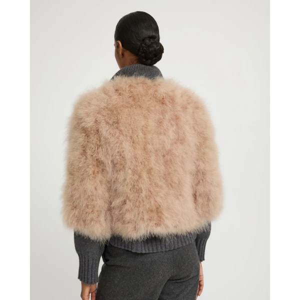 Woman wearing Yves Salomon shearling fur coat – luxury outerwear at Coveti