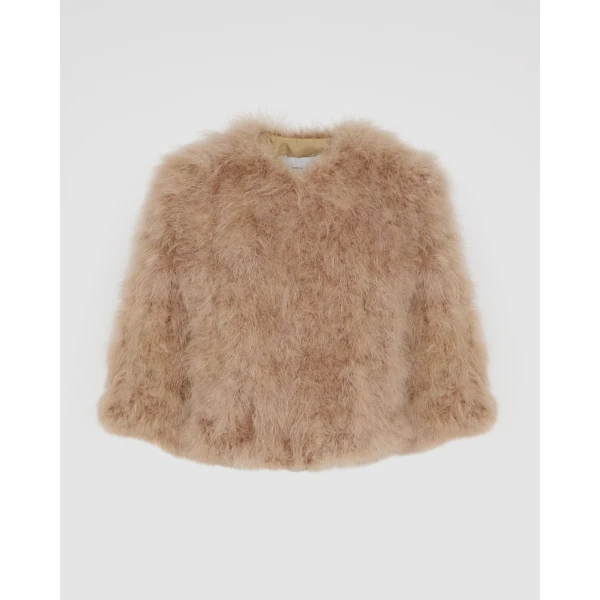 Woman wearing Yves Salomon shearling fur coat – luxury outerwear at Coveti