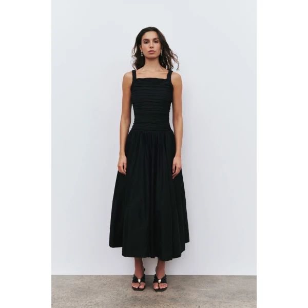Aje Aus Dresses – structured silhouette with raw femininity from Coveti