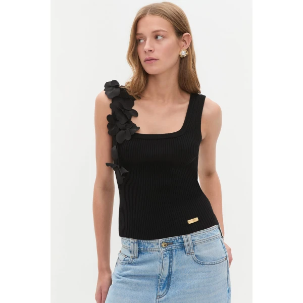 Aje Aus Tops – structured silhouette with raw femininity from Coveti