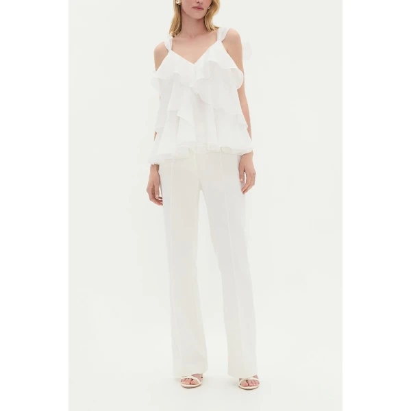Aje Aus Tops – structured silhouette with raw femininity from Coveti
