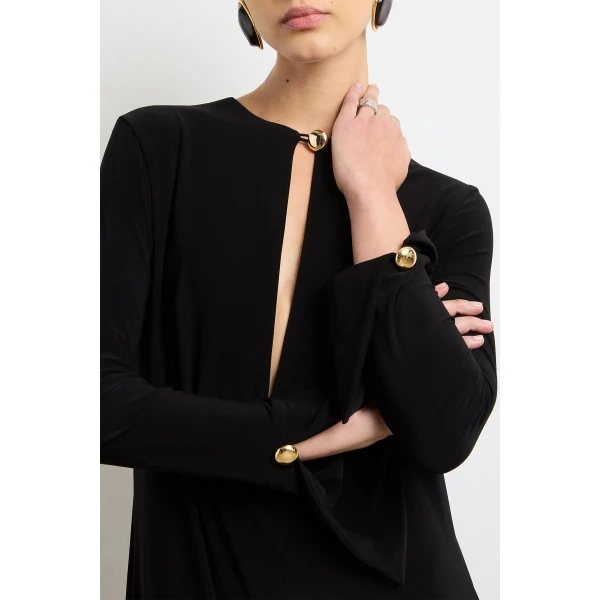 Brandon Maxwell Black Dresses with sculptural silhouette photographed against minimal backdrop
