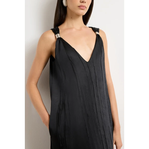 Brandon Maxwell Black Dresses with sculptural silhouette photographed against minimal backdrop
