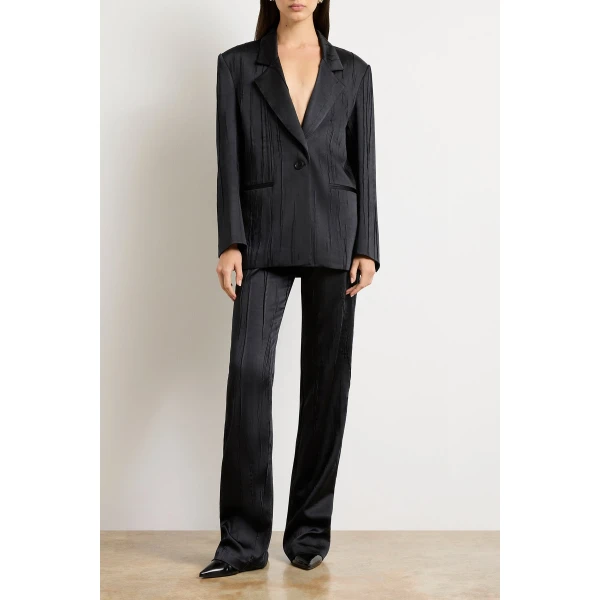 Brandon Maxwell Black Jackets with sculptural silhouette photographed against minimal backdrop