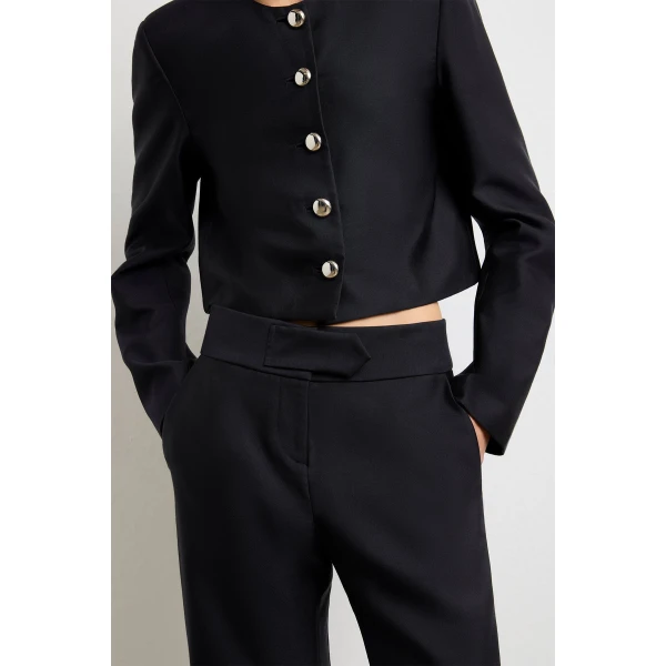 Brandon Maxwell Black Pants with sculptural silhouette photographed against minimal backdrop