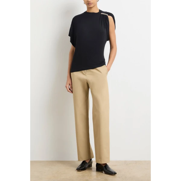 Brandon Maxwell Black Tops with sculptural silhouette photographed against minimal backdrop