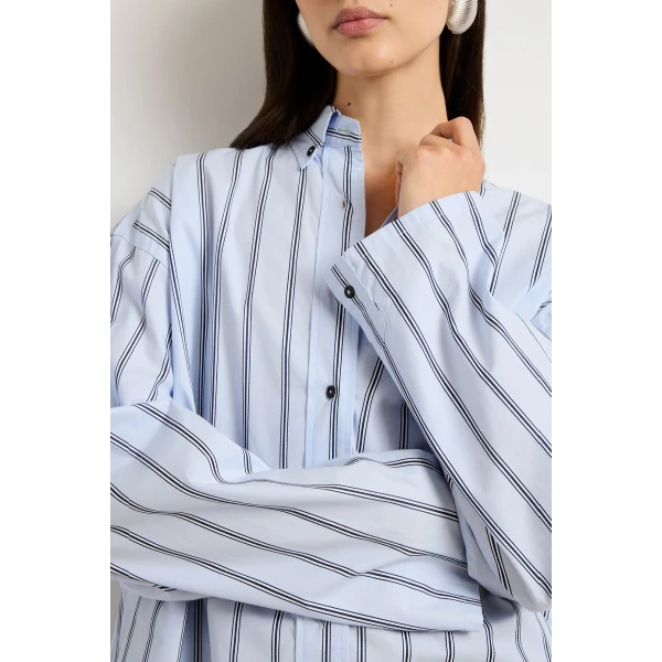 Brandon Maxwell Blue Tops with sculptural silhouette photographed against minimal backdrop