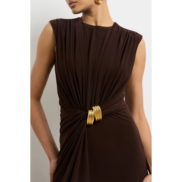 Brandon Maxwell red evening dress styled with sleek accessories