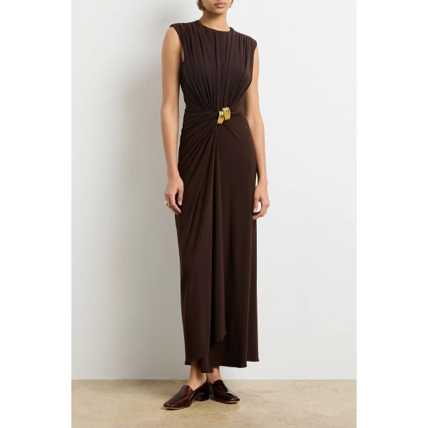 Brandon Maxwell Brown Dresses with sculptural silhouette photographed against minimal backdrop