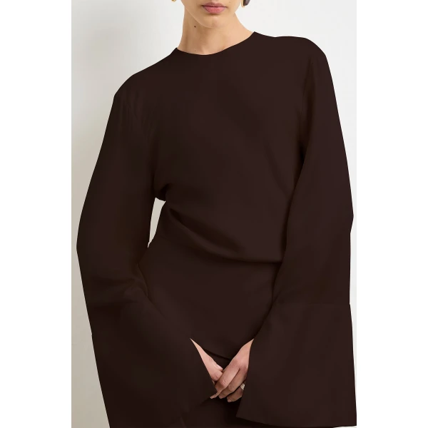 Brandon Maxwell Brown Dresses with sculptural silhouette photographed against minimal backdrop