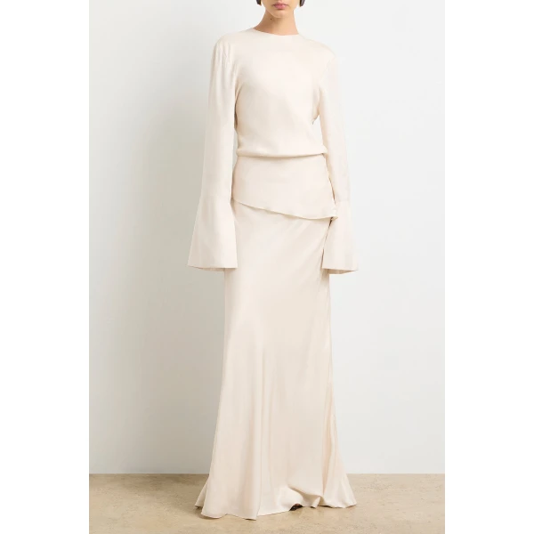 Brandon Maxwell red evening dress styled with sleek accessories