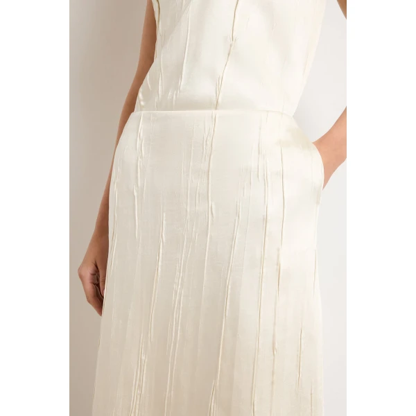 Brandon Maxwell Ivory Skirts with sculptural silhouette photographed against minimal backdrop