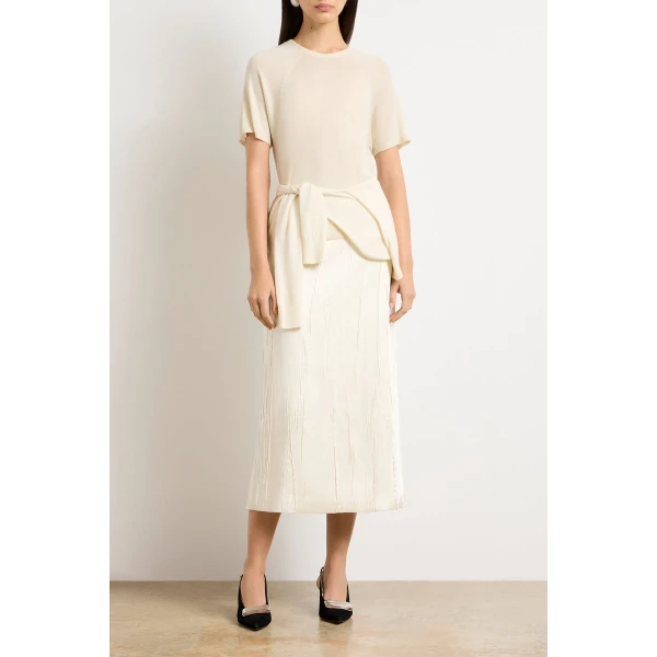 Brandon Maxwell Ivory Tops with sculptural silhouette photographed against minimal backdrop