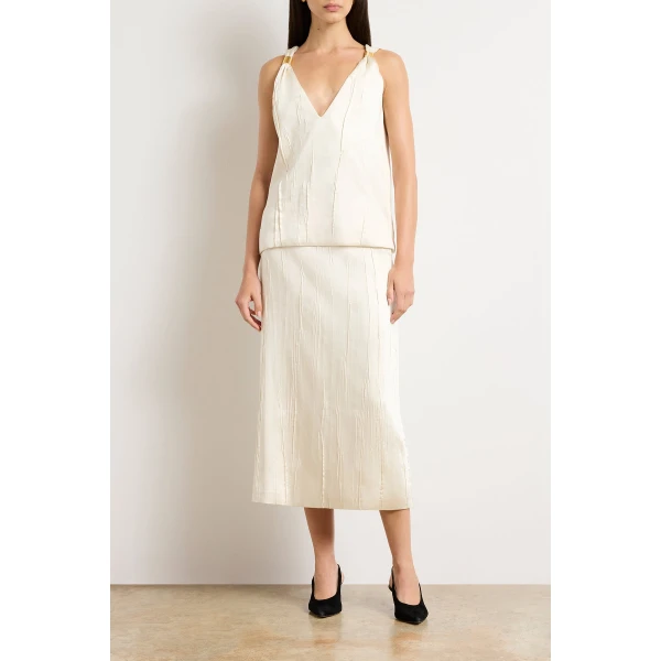 Brandon Maxwell Ivory Tops with sculptural silhouette photographed against minimal backdrop