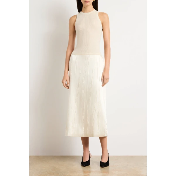Brandon Maxwell Ivory Tops with sculptural silhouette photographed against minimal backdrop