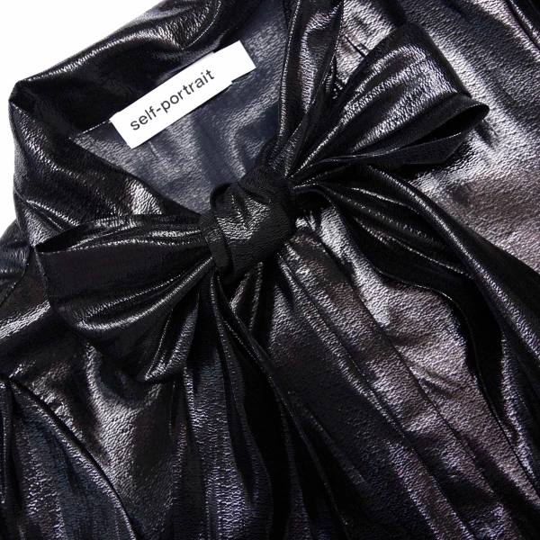 Elevate your elegance in this Self Portrait Tops  from the 2025 resort wear edit