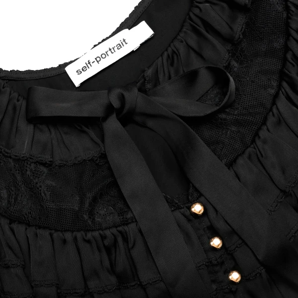 Elevate your elegance in this Self Portrait Tops  from the 2025 resort wear edit