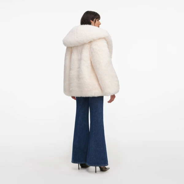 Elevate your elegance in this Self Portrait Coats  from the 2025 resort wear edit