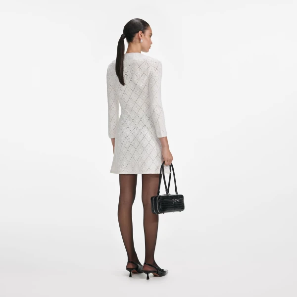 Elevate your elegance in this Self Portrait Dresses Mini Dress from the 2025 resort wear edit