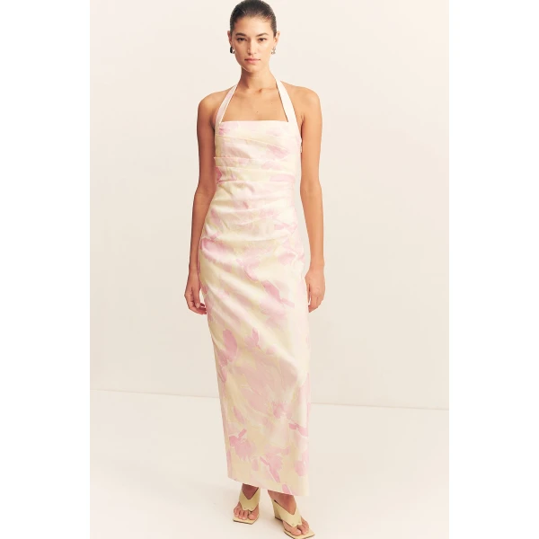 Draped halter maxi dress in the blush daylily print in a premium stretch linen blend.