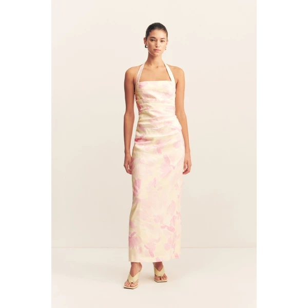 Draped halter maxi dress in the blush daylily print in a premium stretch linen blend.