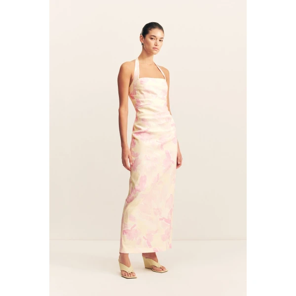 Draped halter maxi dress in the blush daylily print in a premium stretch linen blend.