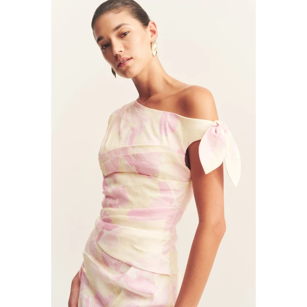 Asymmetrical tie mini dress in the blush daylily print in a premium stretch linen blend.