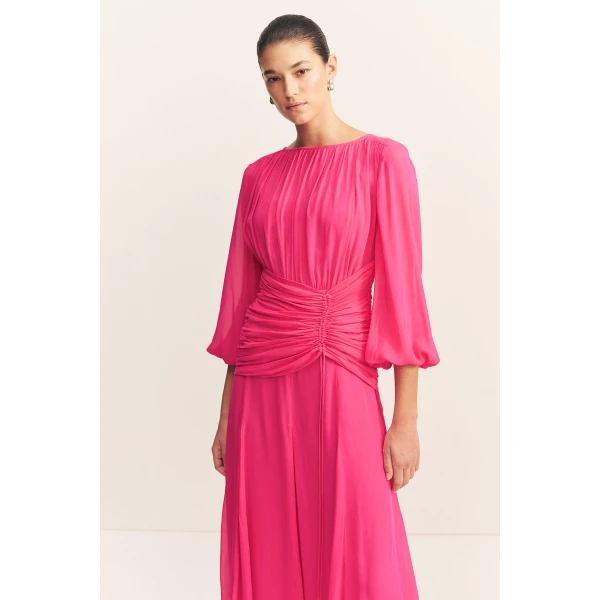 High neck balloon sleeve maxi dress in fuchsia in a semi-sheer georgette.