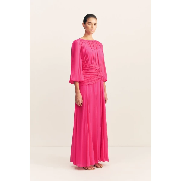 High neck balloon sleeve maxi dress in fuchsia in a semi-sheer georgette.