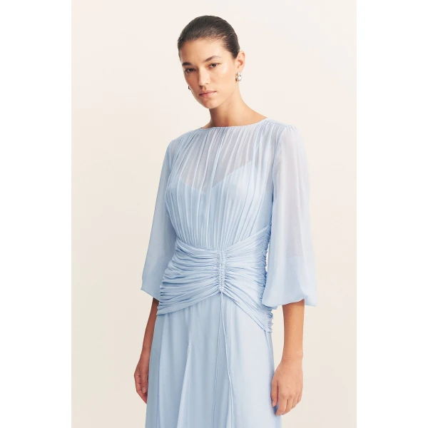 High neck balloon sleeve maxi dress in fuchsia in a semi-sheer georgette.