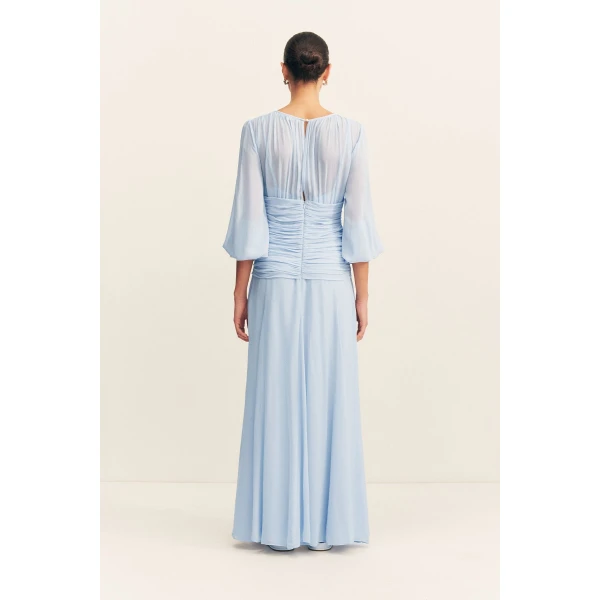 High neck balloon sleeve maxi dress in fuchsia in a semi-sheer georgette.