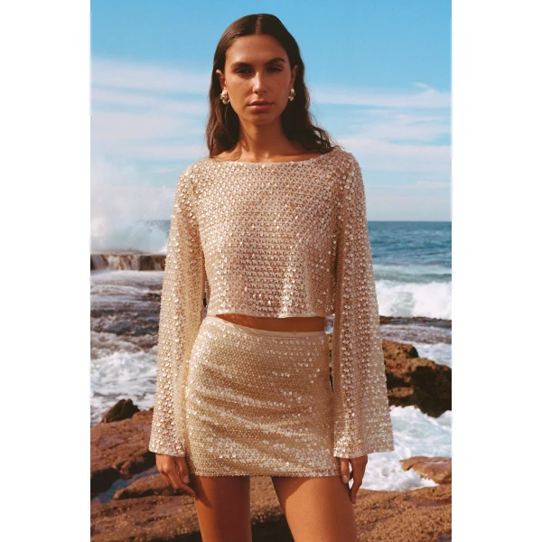 Long sleeve top in a macadamia sequin and bead embellished mesh.