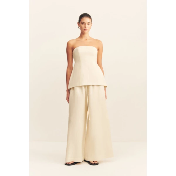 Strapless hourglass bustier in a premium linen blend in ecru.