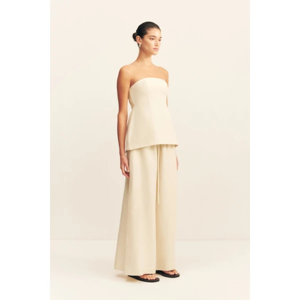 Strapless hourglass bustier in a premium linen blend in ecru.