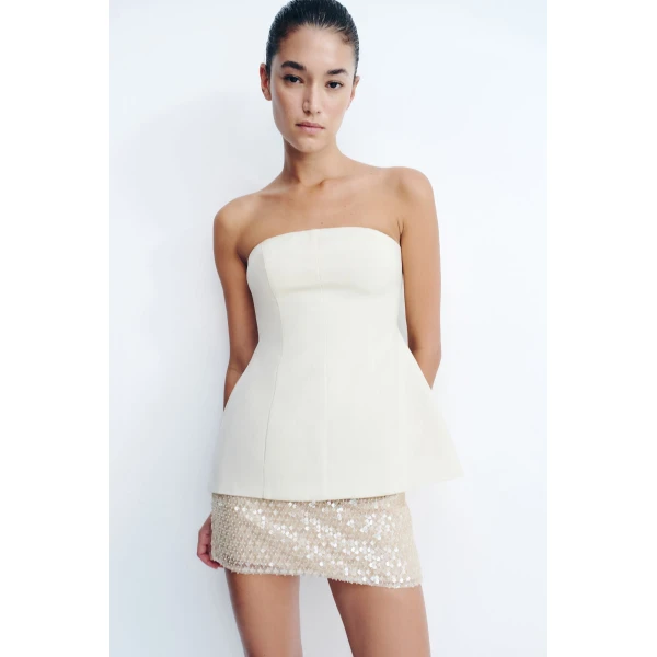 Strapless hourglass bustier in a premium linen blend in ecru.