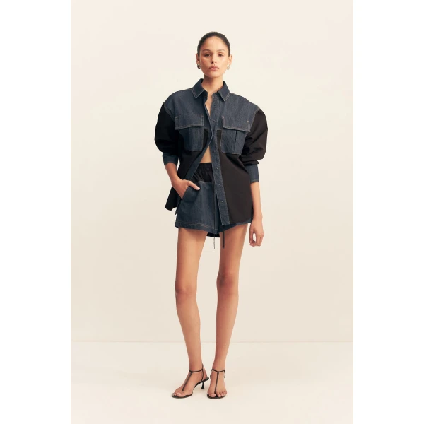Long sleeve shirt in a dark wash denim contrasted with a black cotton poplin.