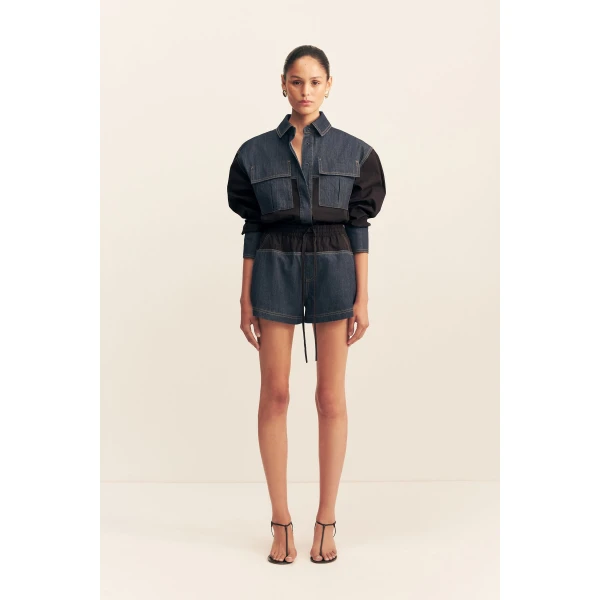 Elasticated short with drawstring in a dark wash denim contrasted with a black cotton poplin.