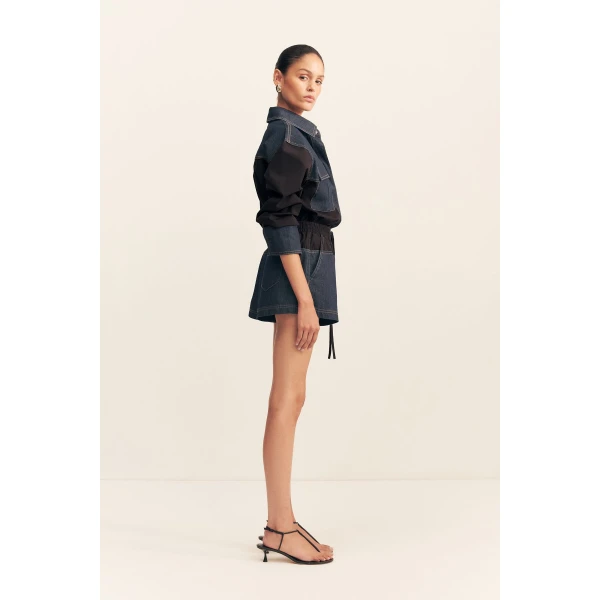 Elasticated short with drawstring in a dark wash denim contrasted with a black cotton poplin.